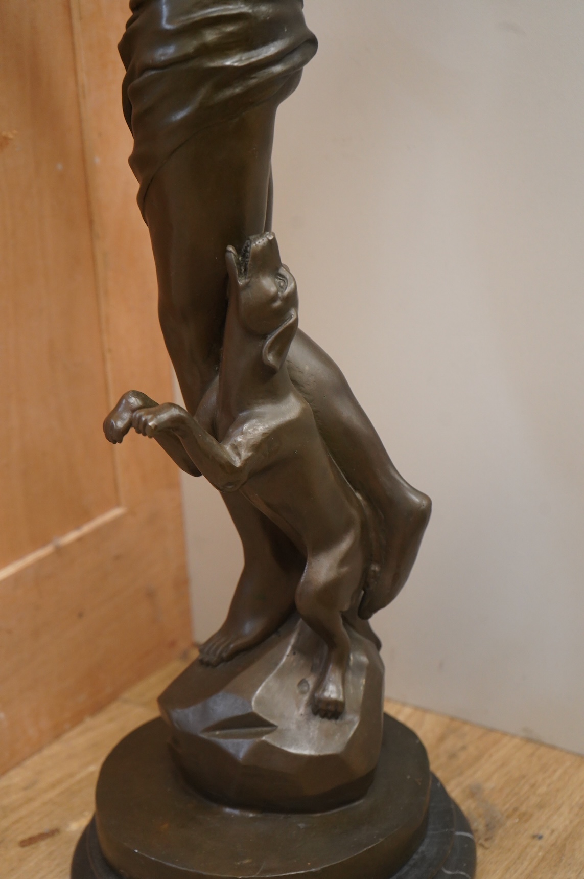 A large Art Deco style patinated bronze figure of Diana, unsigned on black marble base, height 85cm